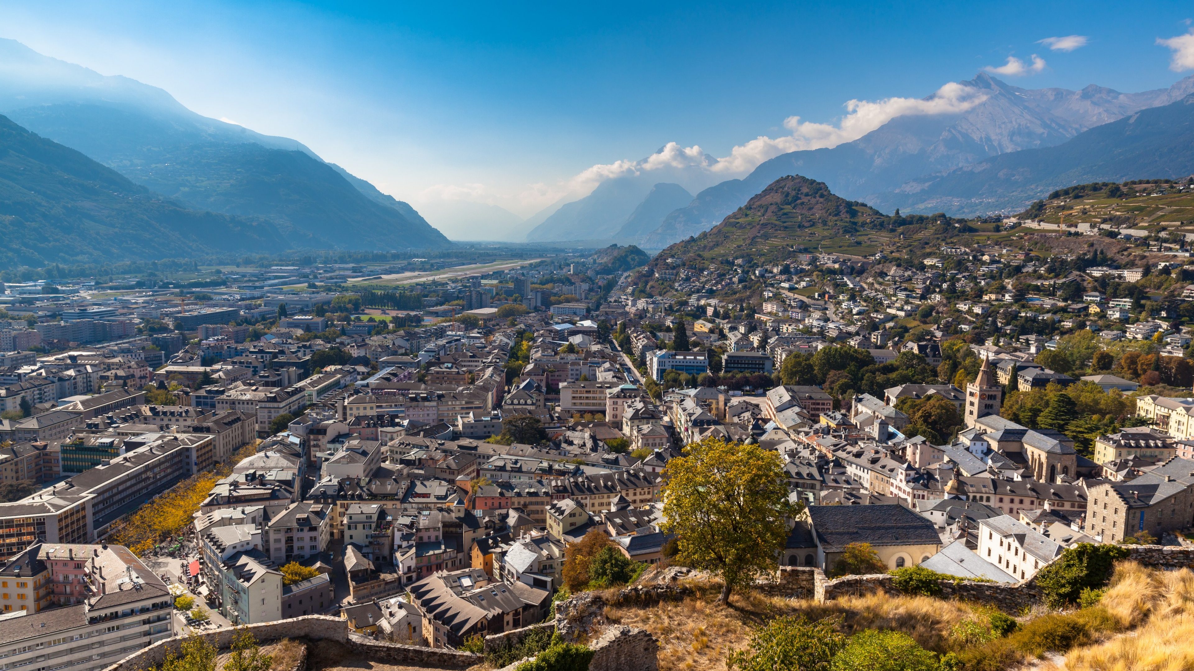 Aerial view of the old town of Sion city from the Tourbillon castle on a sunny day, canton of Valais, Switzerland