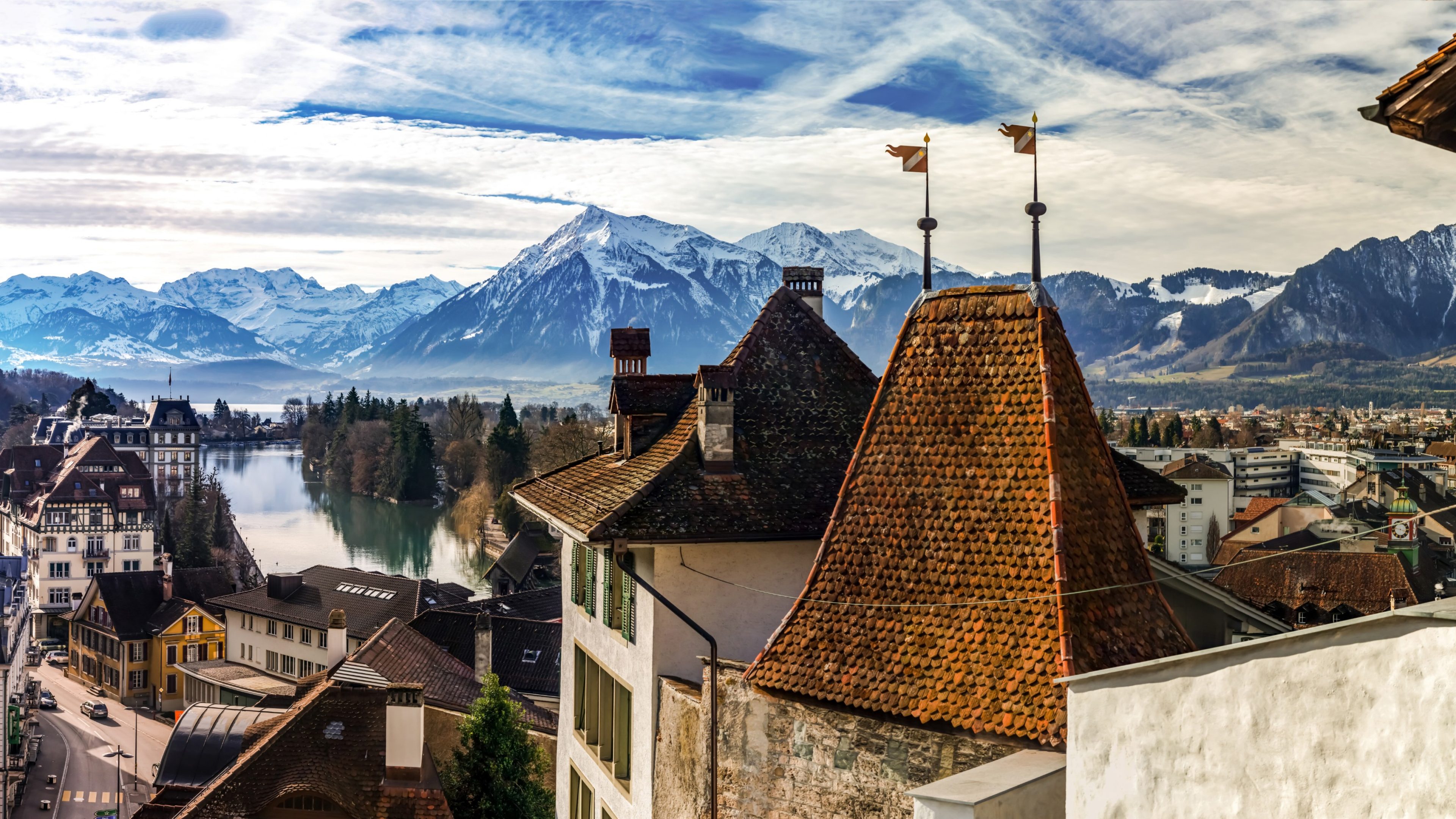 Beautiful panoramic view of Thun old city roofs and Alps on background, Switzerland