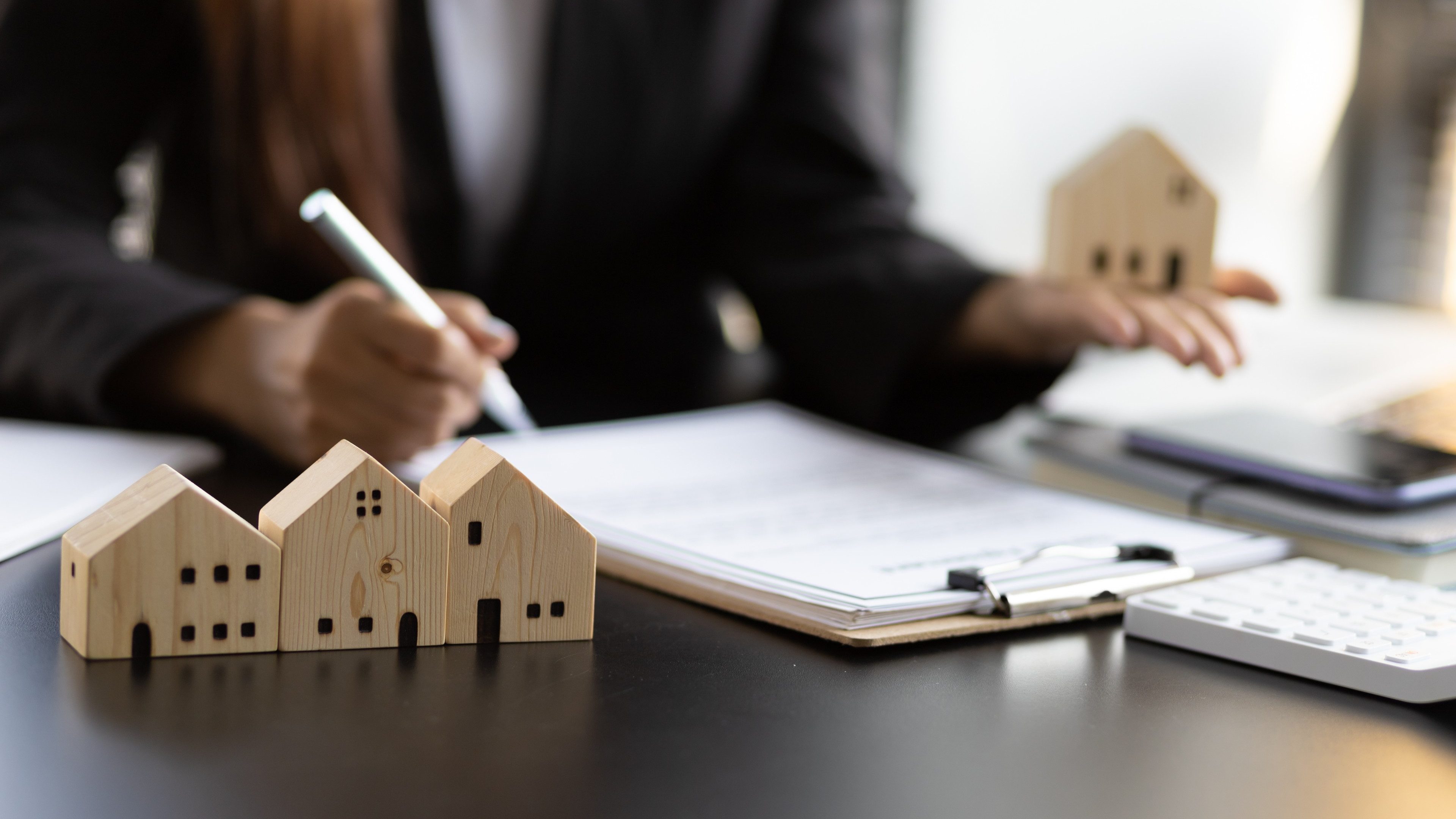 Real estate contract signing concept. Businesswoman signing a contract to legally for the purchase, mortgage and rental of real estate.