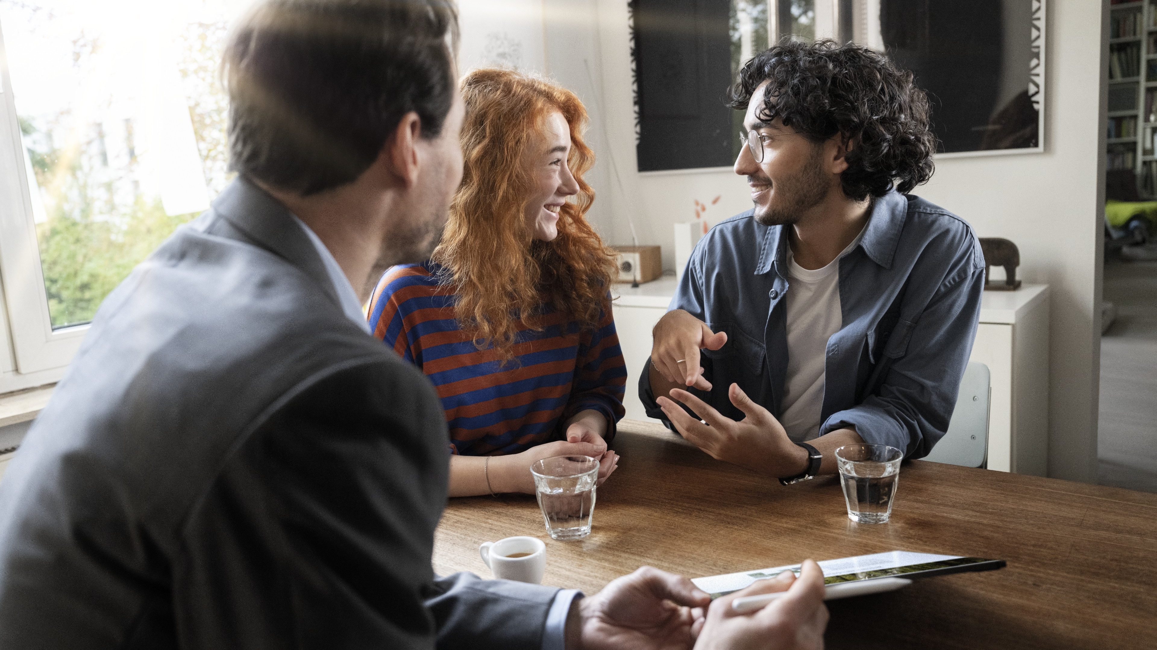 A couple is talking to an insurance consultant.