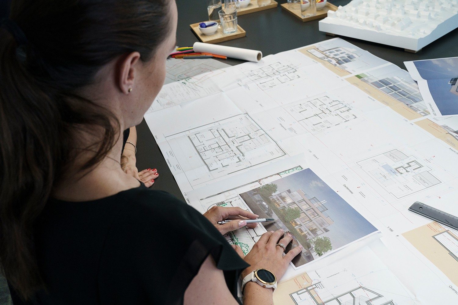An architect examines a blueprint.
