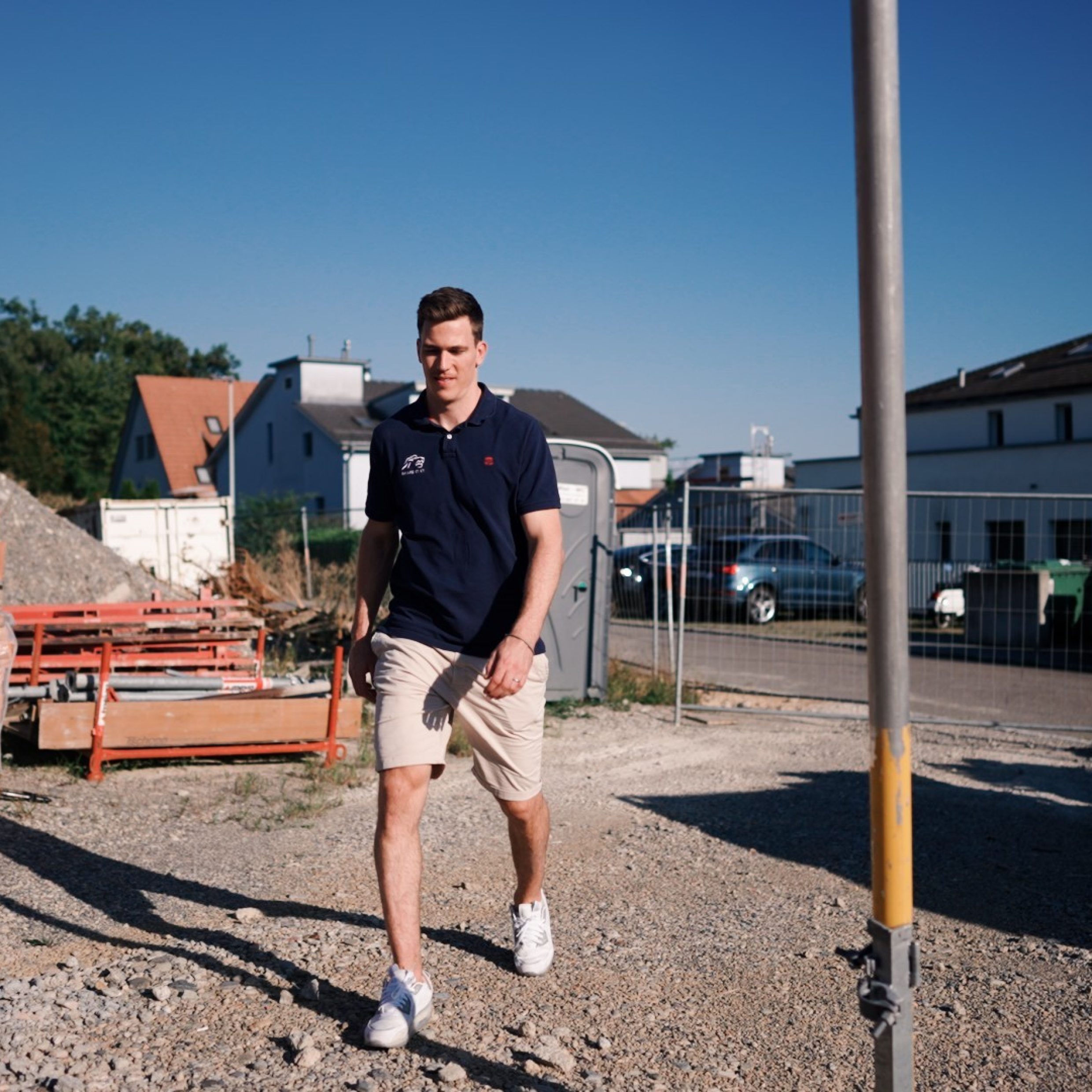 ZSC Player Reto Schäppi on a plot of land on which a house is soon to be built.