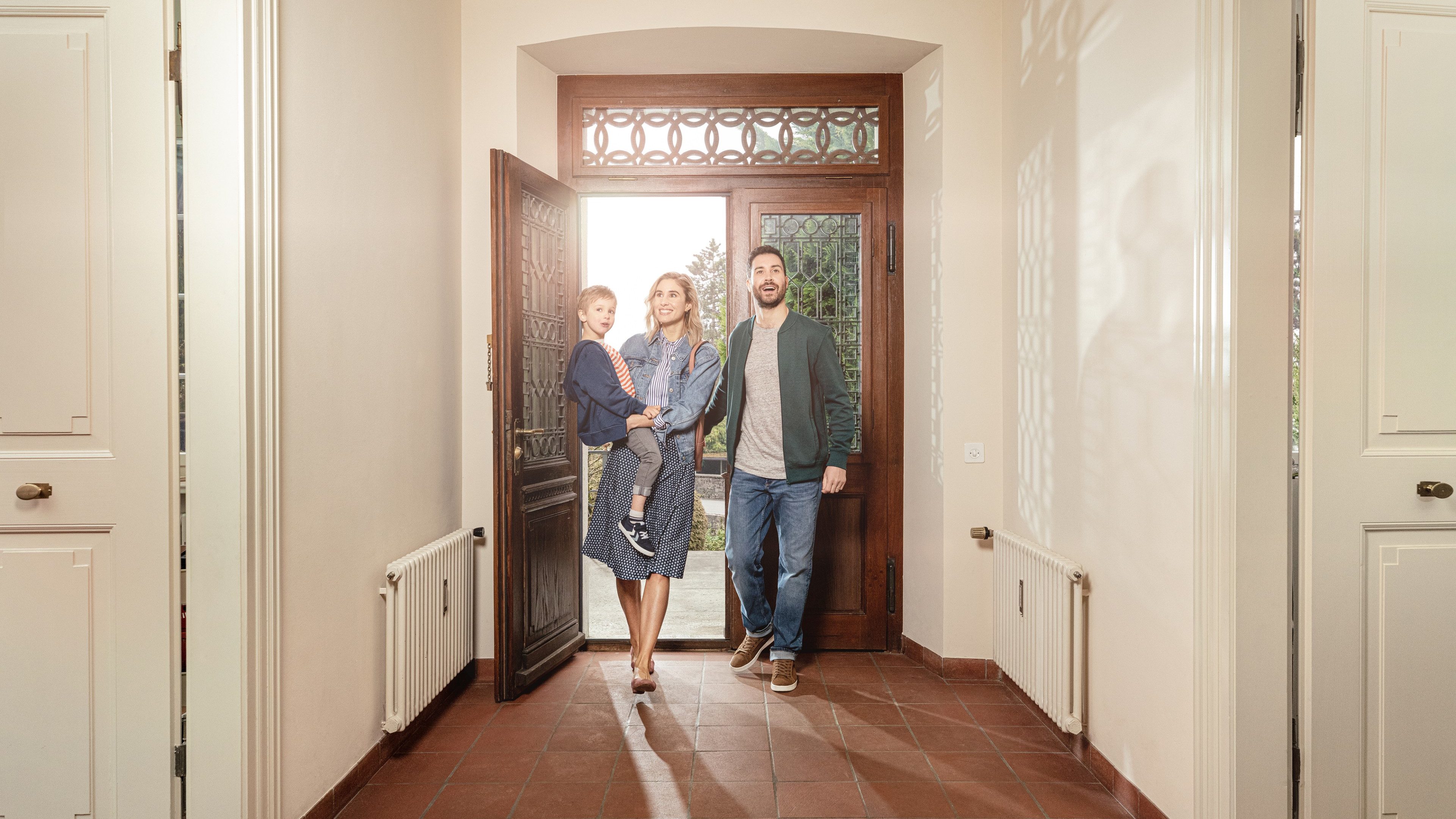 Parents with children visit a property.