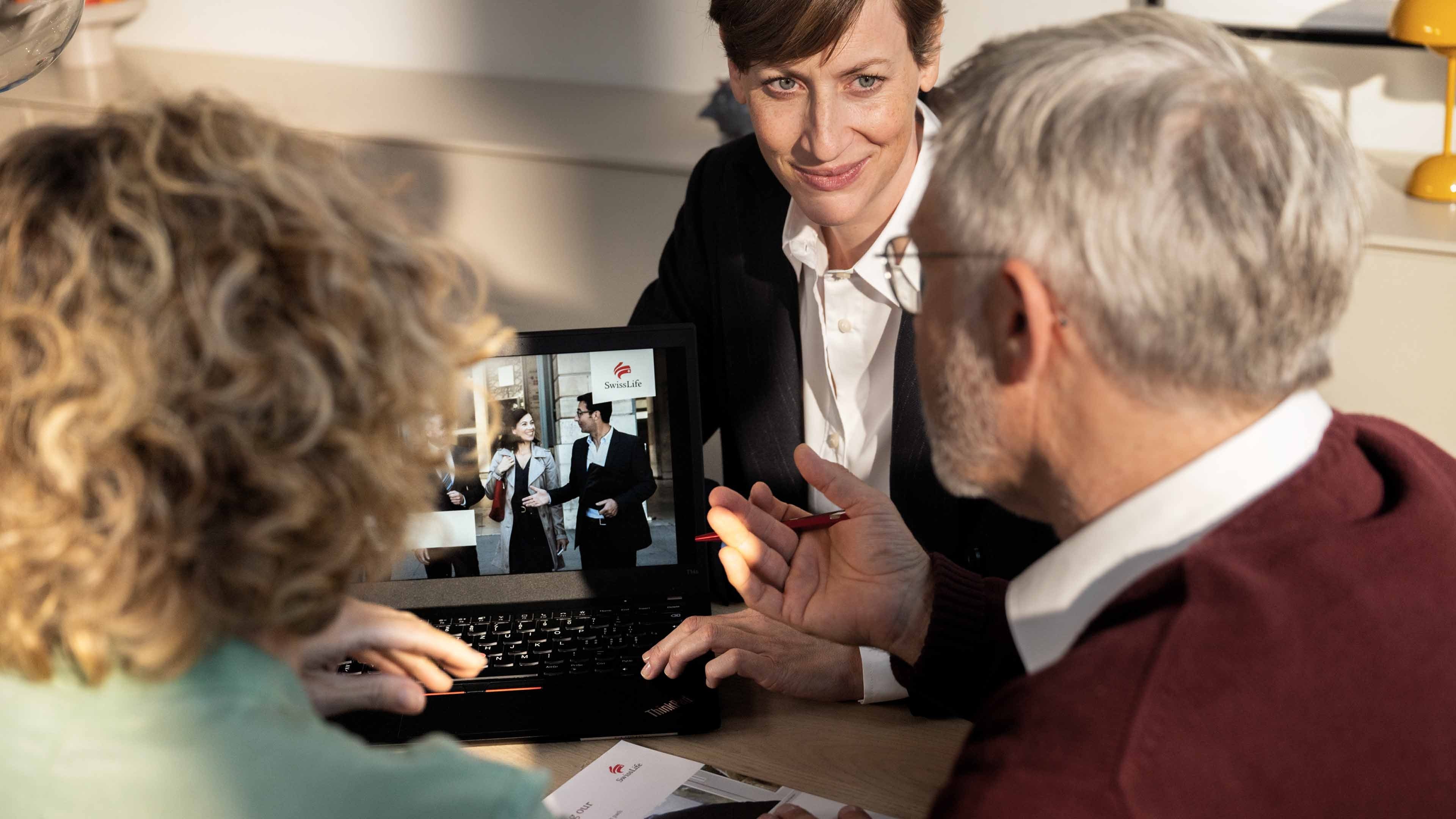 A pensions advisor talking to a man and a woman