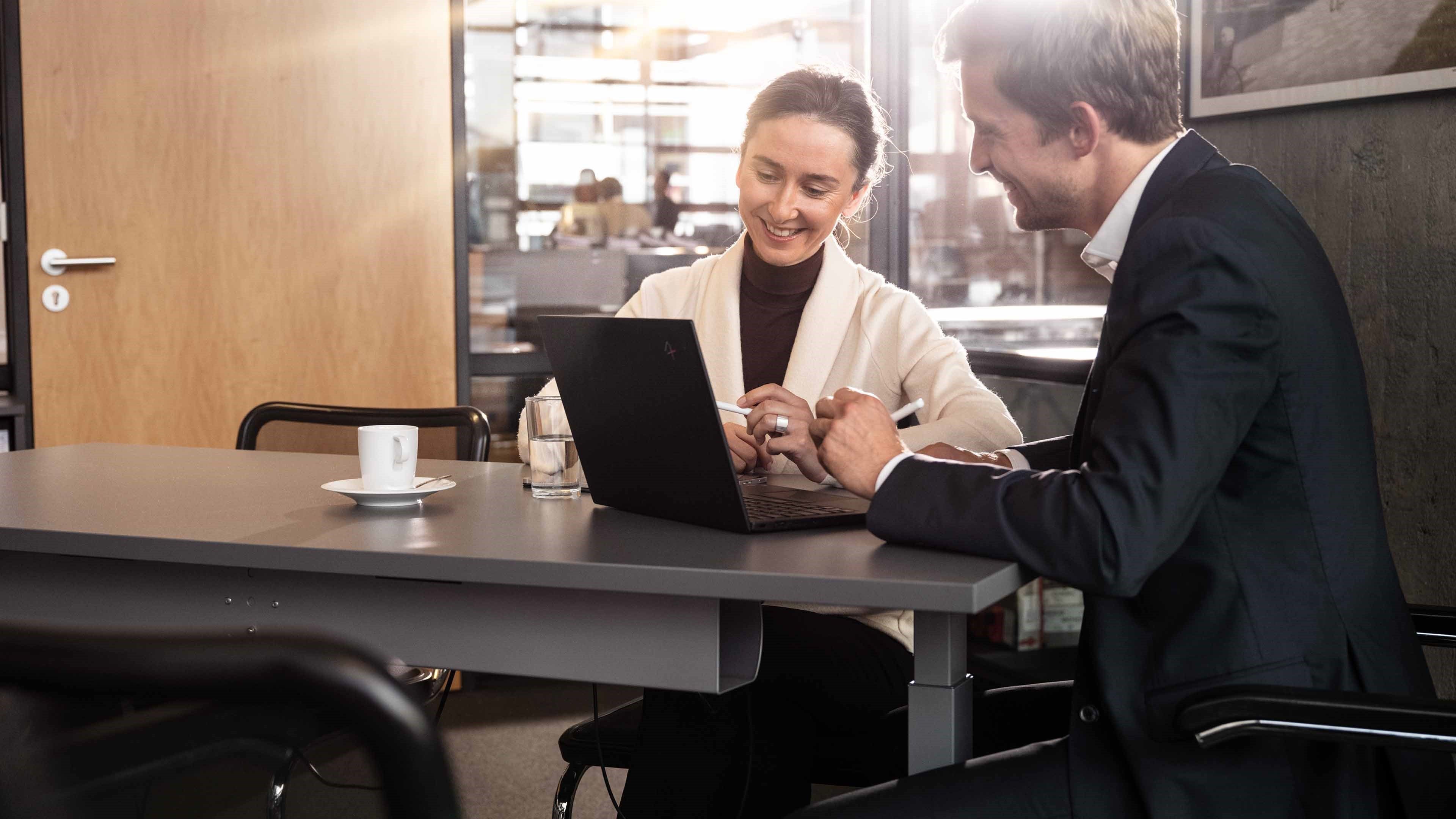 A pensions advisor outlining various investment scenarios for his customer