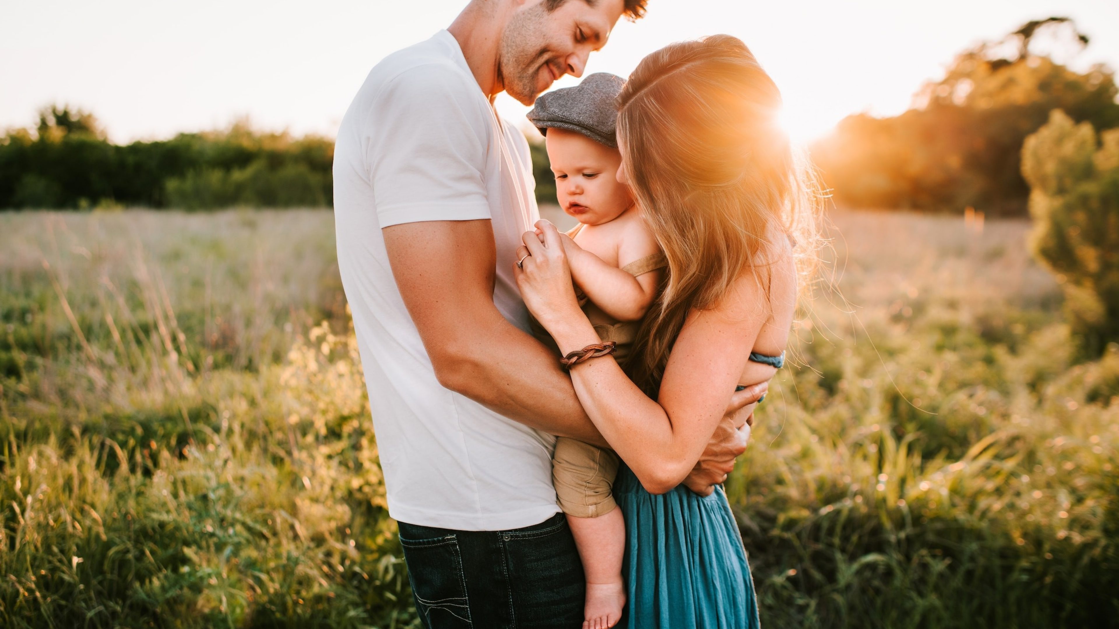 Parents lovingly hold their baby
