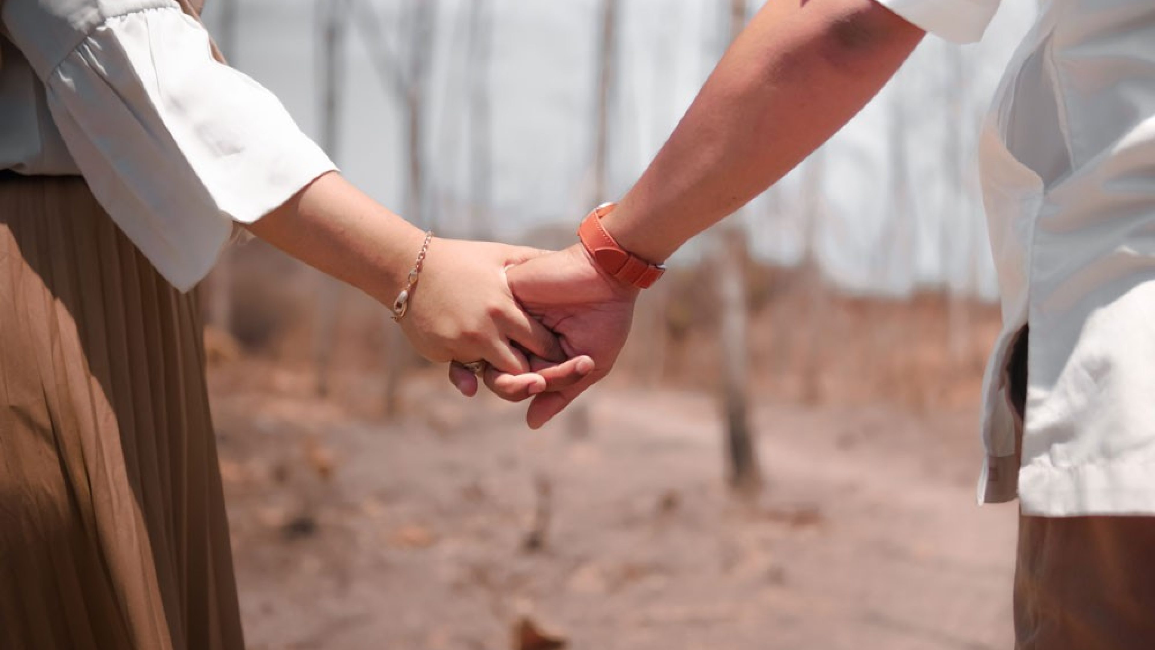 Hands clasping.