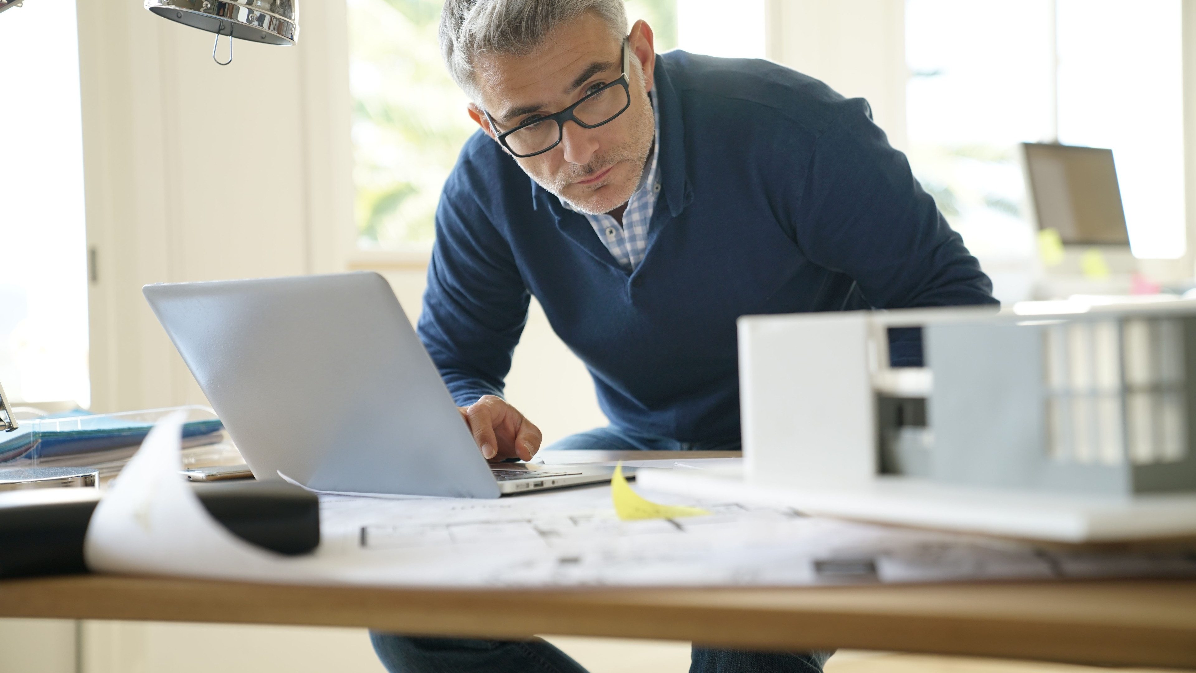 Architect in office working on construction project